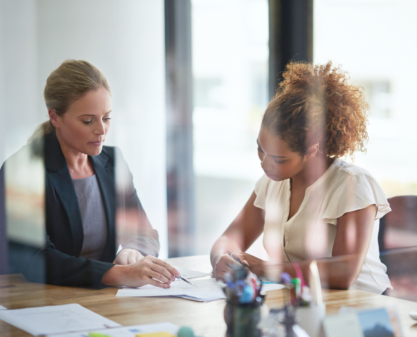 Front View Of Two Women Having Financial Meeting