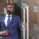 Handsome African American Ceo Leaving Business Center After Meeting