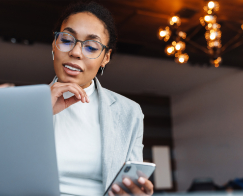 Image Of African American Businesswoman Working On Laptop In Office